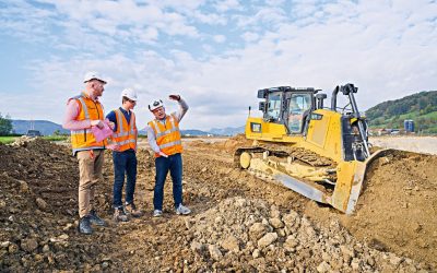 A group of people standing in the dirt