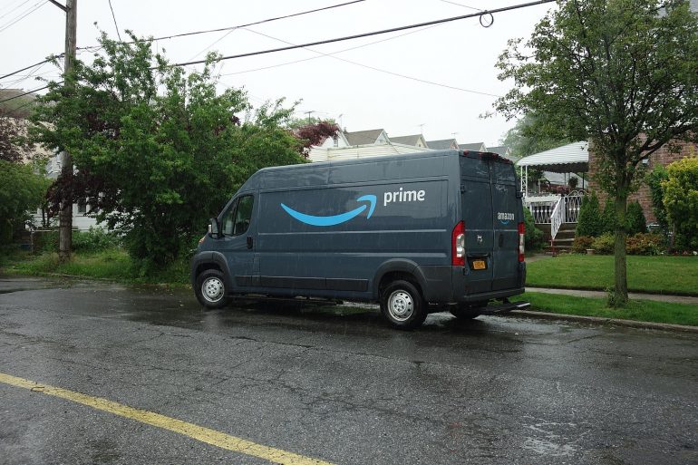 A truck is parked on the side of a road