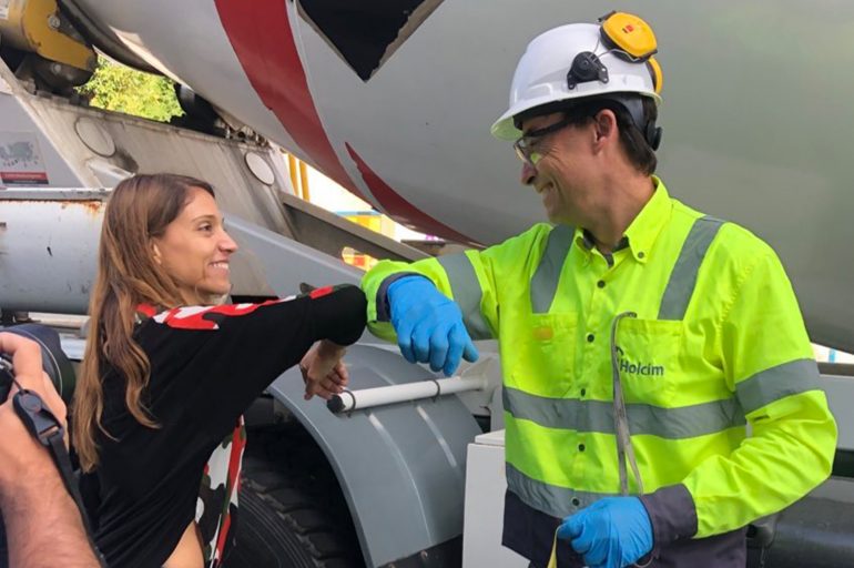 A group of people standing around a plane