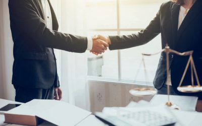 two people shake hands each other