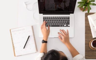 A person working in laptop on table
