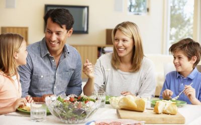 Family sharing meal at dinning table